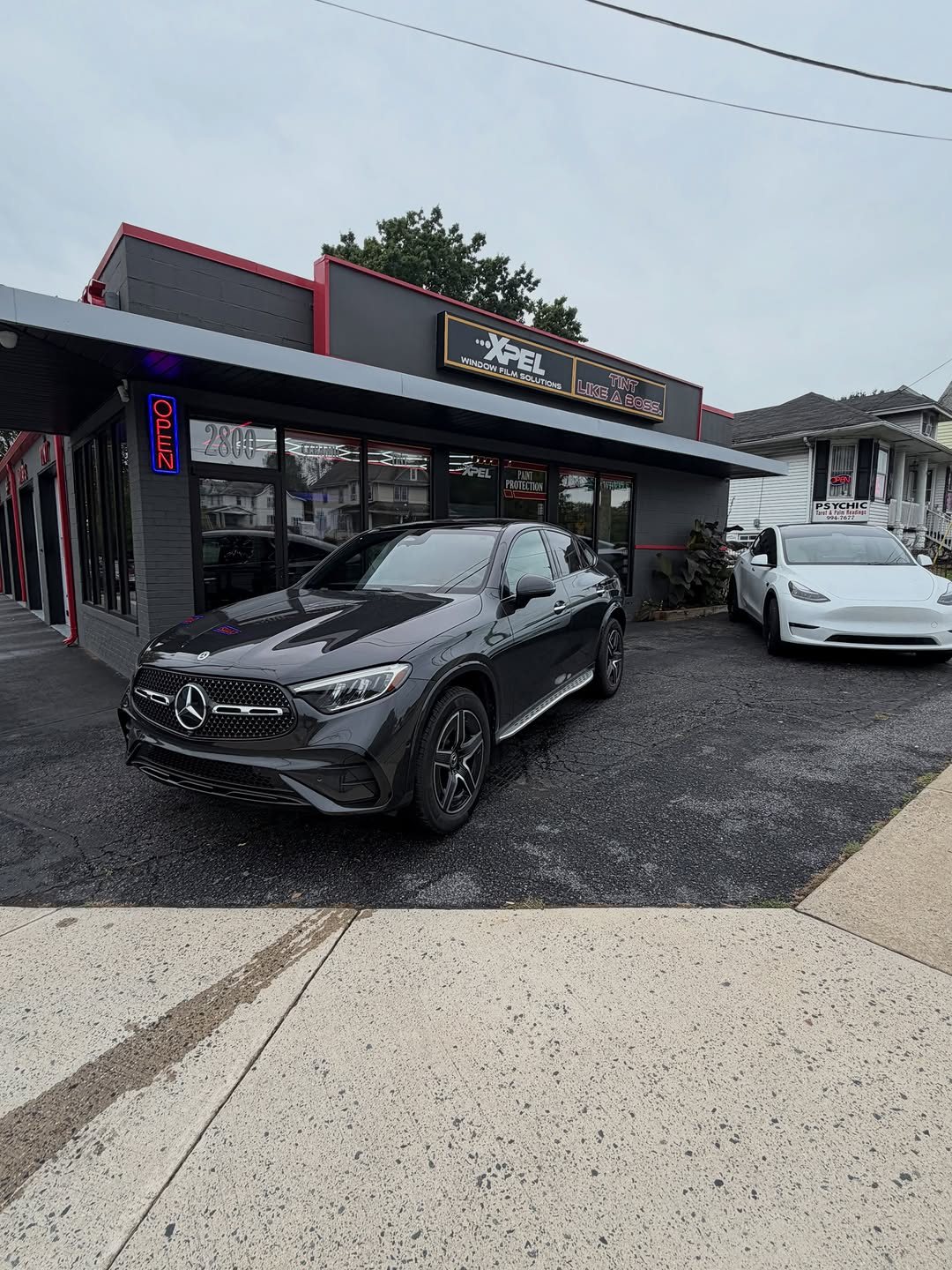 Gray Mercedes-Benz GLC 300 in front of the shop